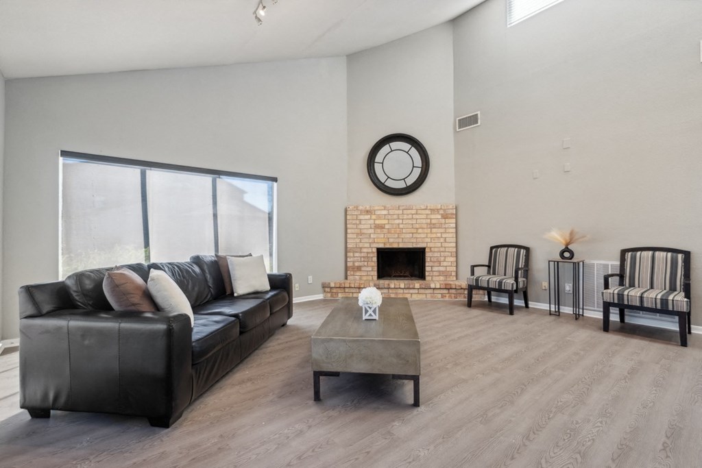 A living room with a fireplace and a couch.