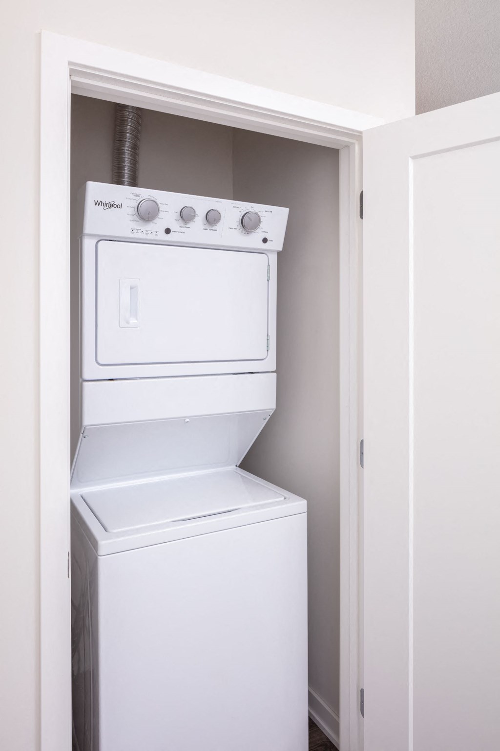 a white washer and dryer in a closet at Maven on Broadway, Minnesota