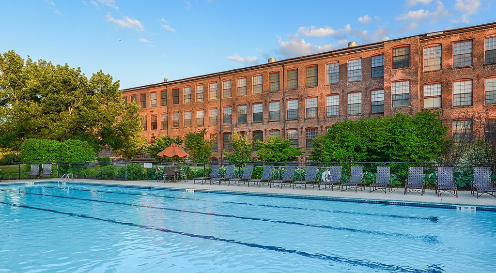 Pool with lounge chairs at Bigelow Commons, Enfield