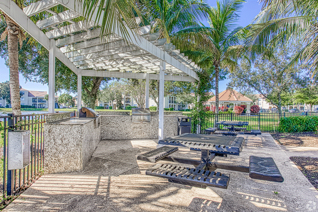 Patio with grill and picnic tables  at Cypress Legends, Fort Myers, 33905