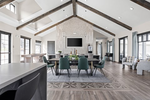a large dining room with a large table and chairs