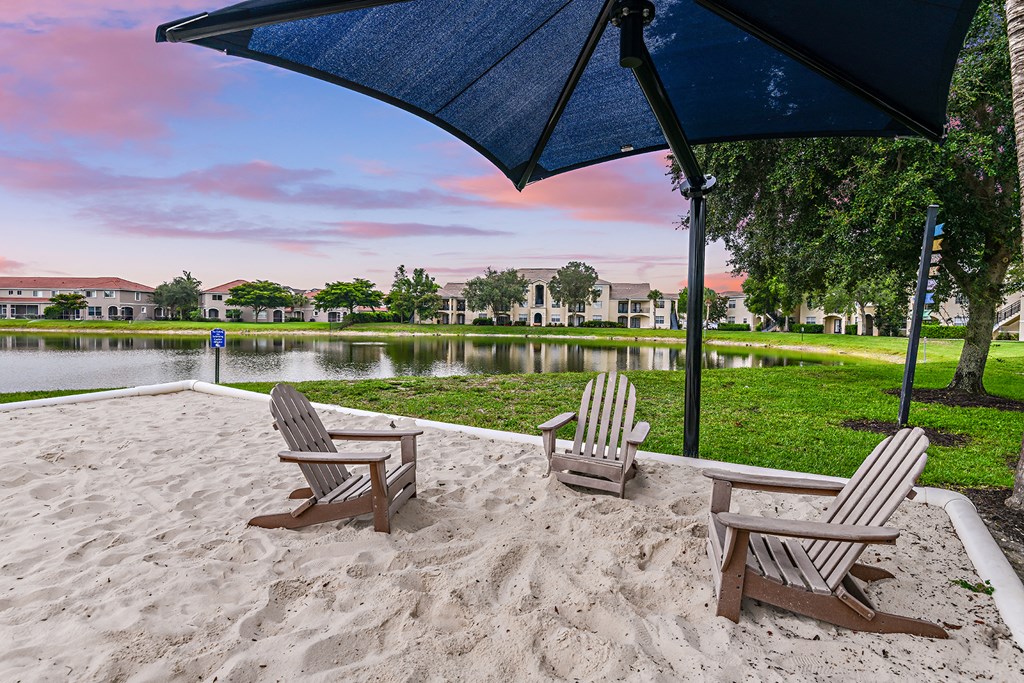 Relax in the adirondack chairs by the water at Cypress Legends, Fort Myers, 33905