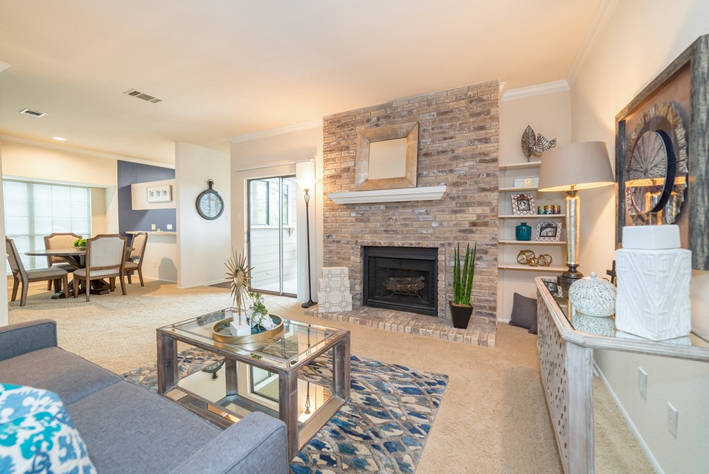 Living room with fireplace | High Oaks Living room with fireplace at High Oaks, Austin, Texas