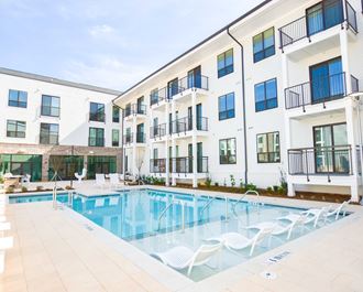 Modern swimming pool with lounge | The Maven at Suwanee