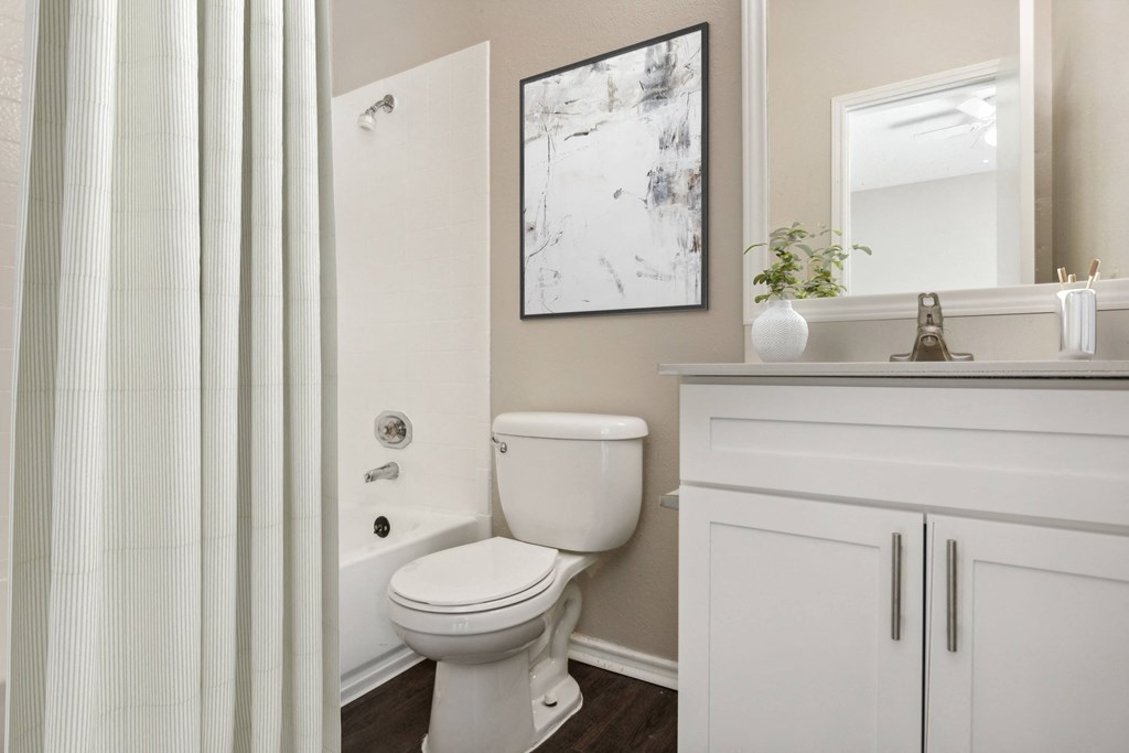 a bathroom with a shower and a toilet and a sink at Canyon Creek, Austin, Texas