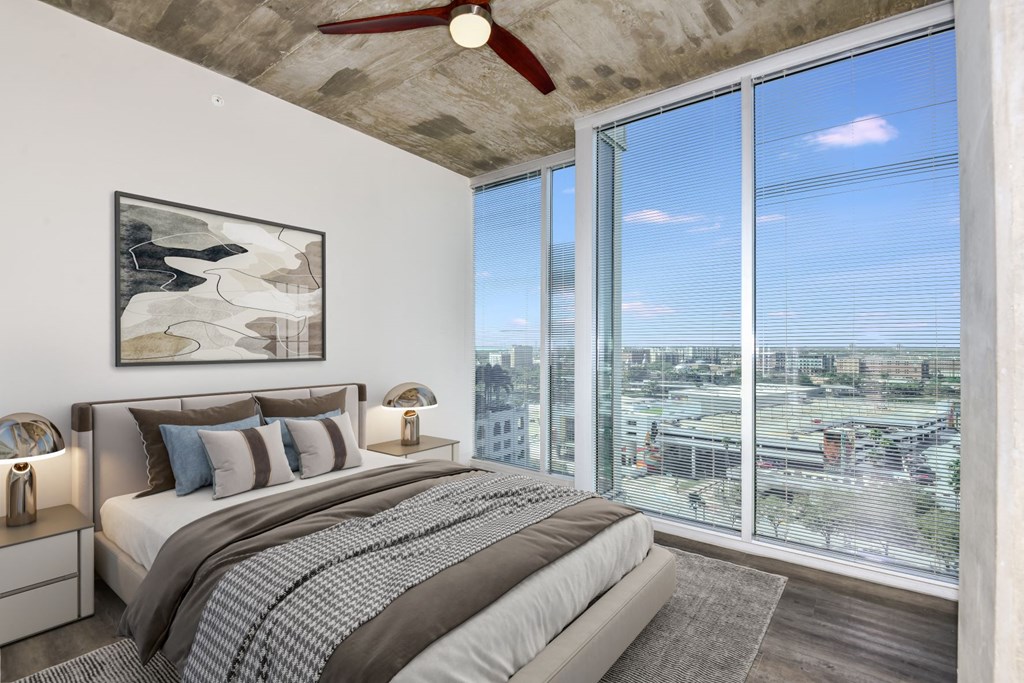 a bedroom with a large window and a ceiling fan at Element, Tampa, 33602
