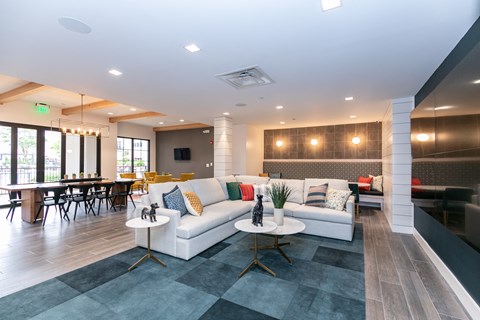 Clubroom with Couches at Emblem Alpharetta Apartments, Alpharetta, 30009