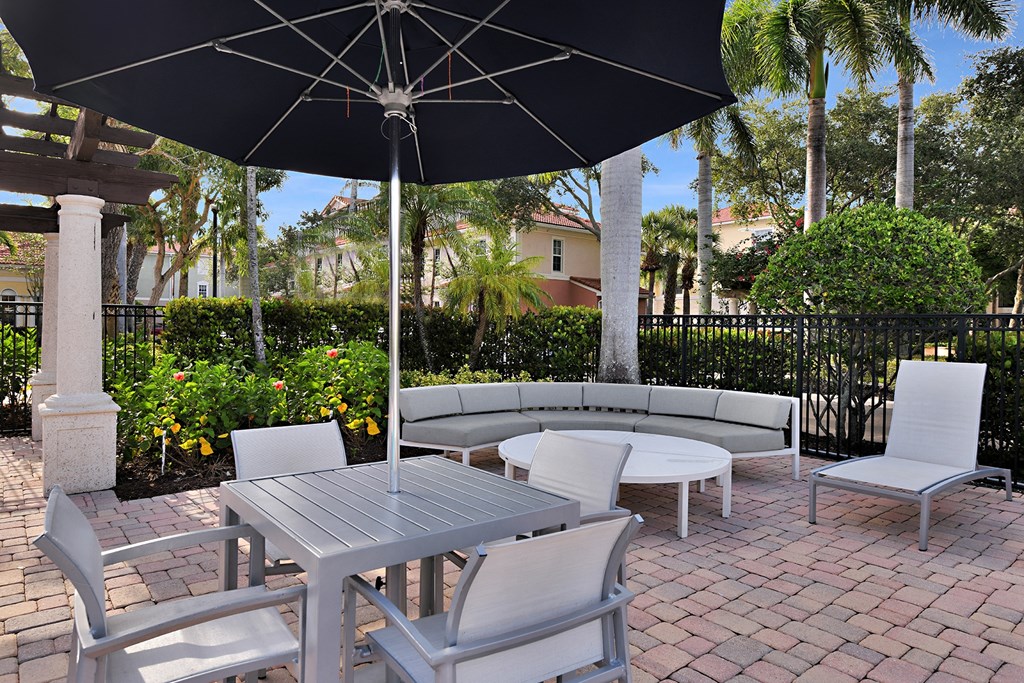 Poolside patio and lounge area at Floresta, Jupiter