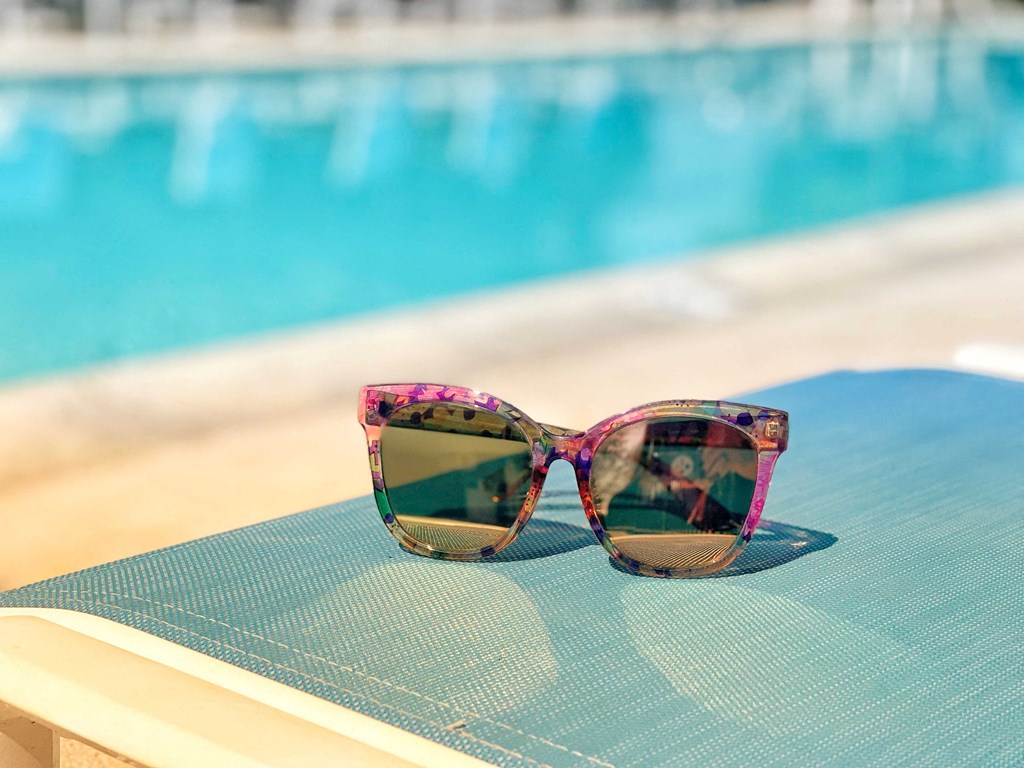 the sunglasses on the background of a blue swimming pool at 2300 West Apartments, Reno, 89502