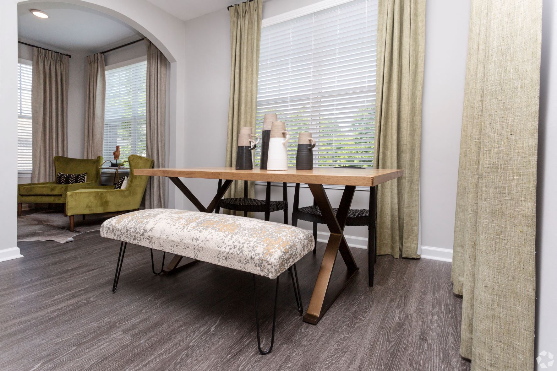 Living area with wood style flooring at Emblem Alpharetta, Alpharetta, GA