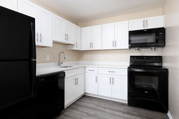 Kitchen with black appliance package  | The Brittany - Photo Gallery 13