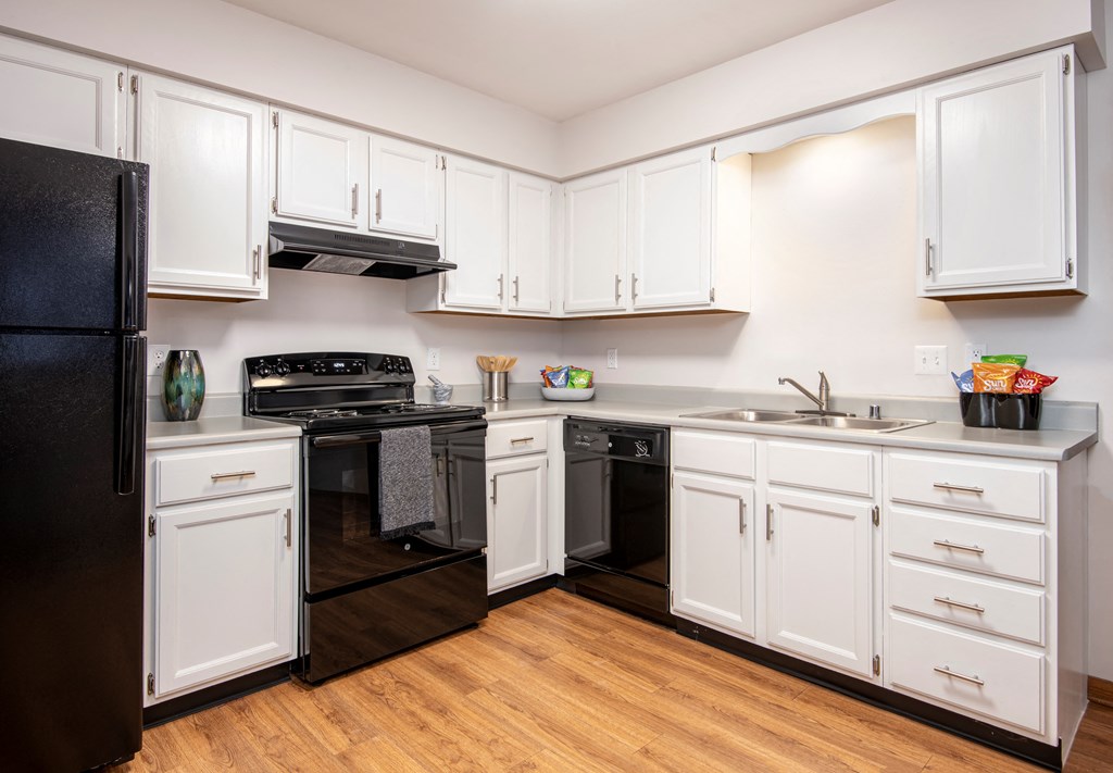 Kitchen with black appliance package | Preserve West at Preserve West, Wisconsin