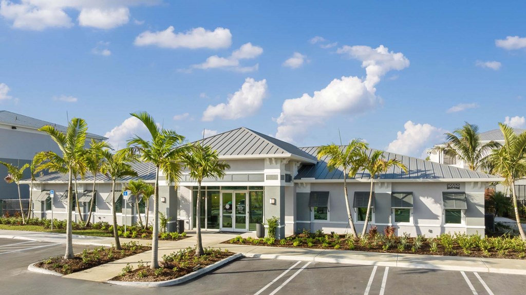A building with a parking lot in front of it. at Lucie at Tradition Apartments, Port St. Lucie 34987