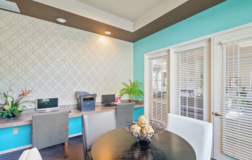 a business center with computers and chairs at Bella Vista on Park, Plant City, FL 33563