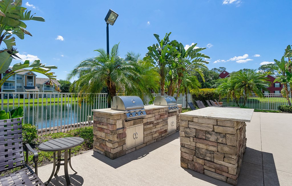 a patio with a barbecue grill and a table at Bella Vista on Park, Plant City Florida