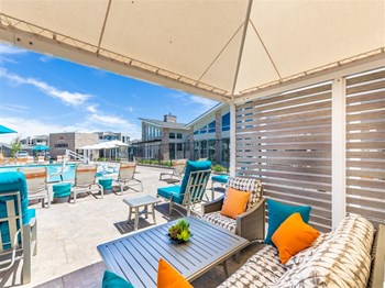 Cabanas by pool poolside cabana with seating and table - Photo Gallery 3