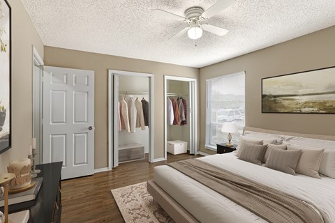 A bedroom with a large bed and a view of the ocean.