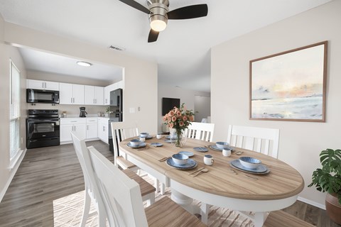 A modern dining room with a wooden table set for six.