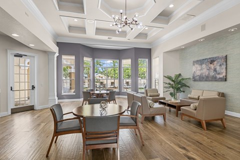 A dining room with a table set for six.