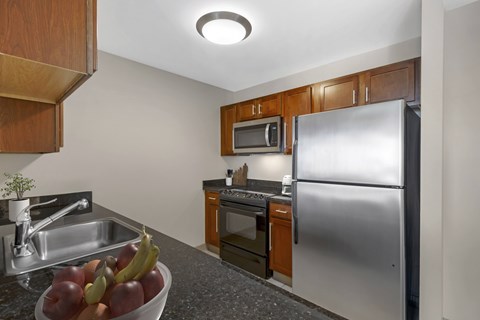 A Kitchen with stainless steel appliances and ample counter space