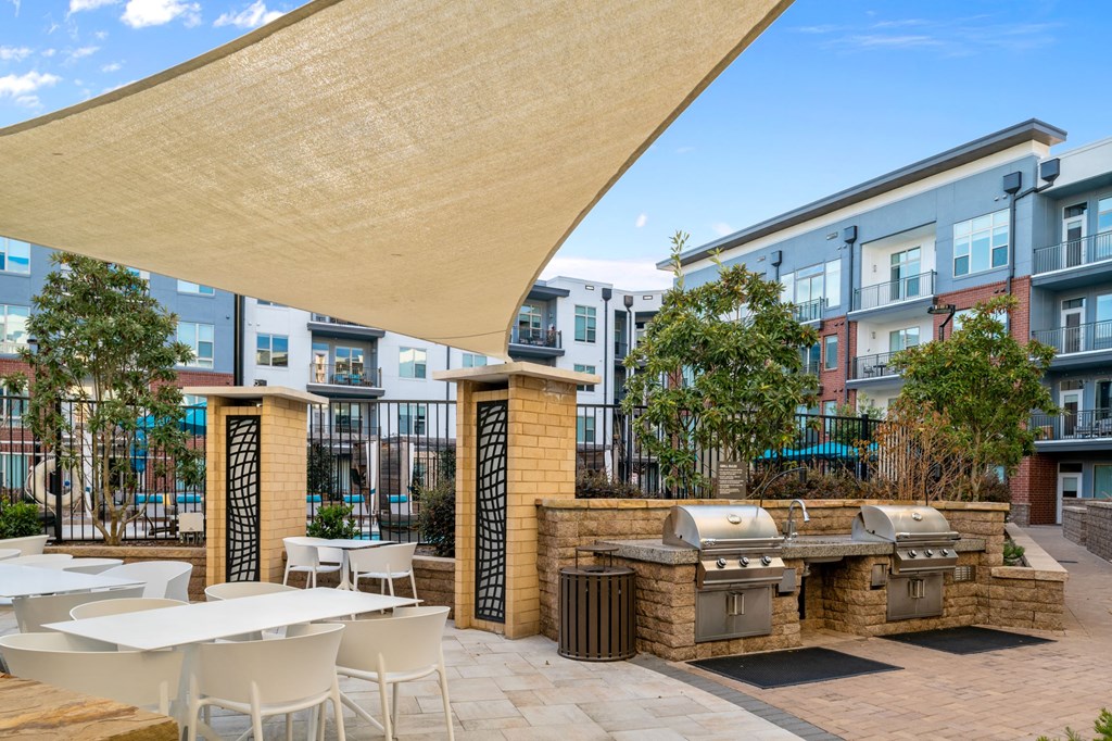 Outdoor patio with grills at Inspire, North Carolina