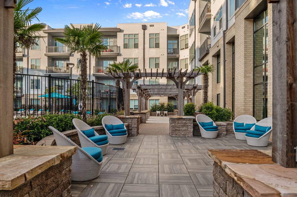Outdoor courtyard with lounge chairs at Inspire, North Carolina, 28211