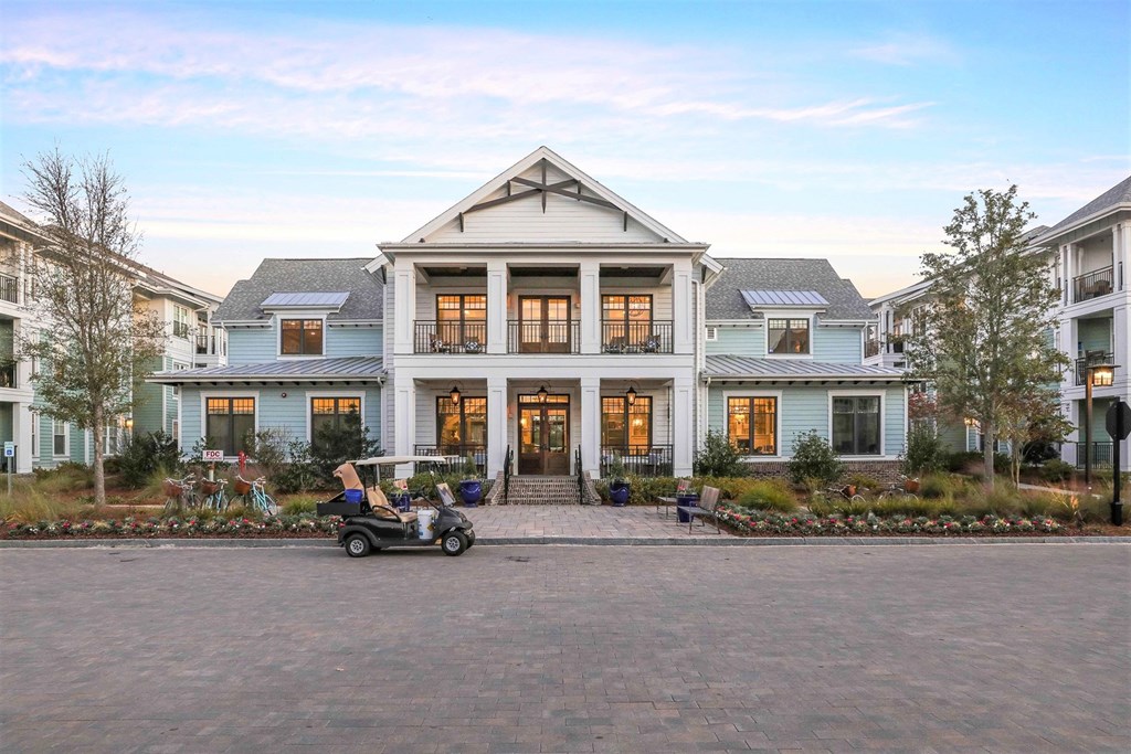A large house with a driveway in front of it at Wharf 7 Apartments, Charleston, 29492