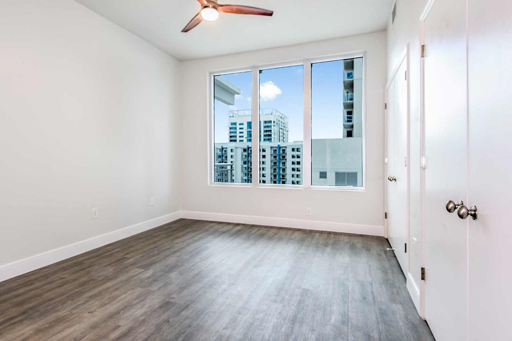 an empty bedroom with a large window at Paramount on Lake Eola, Florida, 32801