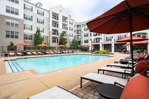 Swimming Pool with Seating around at Emblem Alpharetta Apartments, Alpharetta, Georgia, 30009