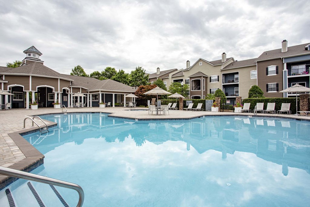 a large swimming pool with apartment buildings in the background at Thornberry Apartments, Charlotte North Carolina