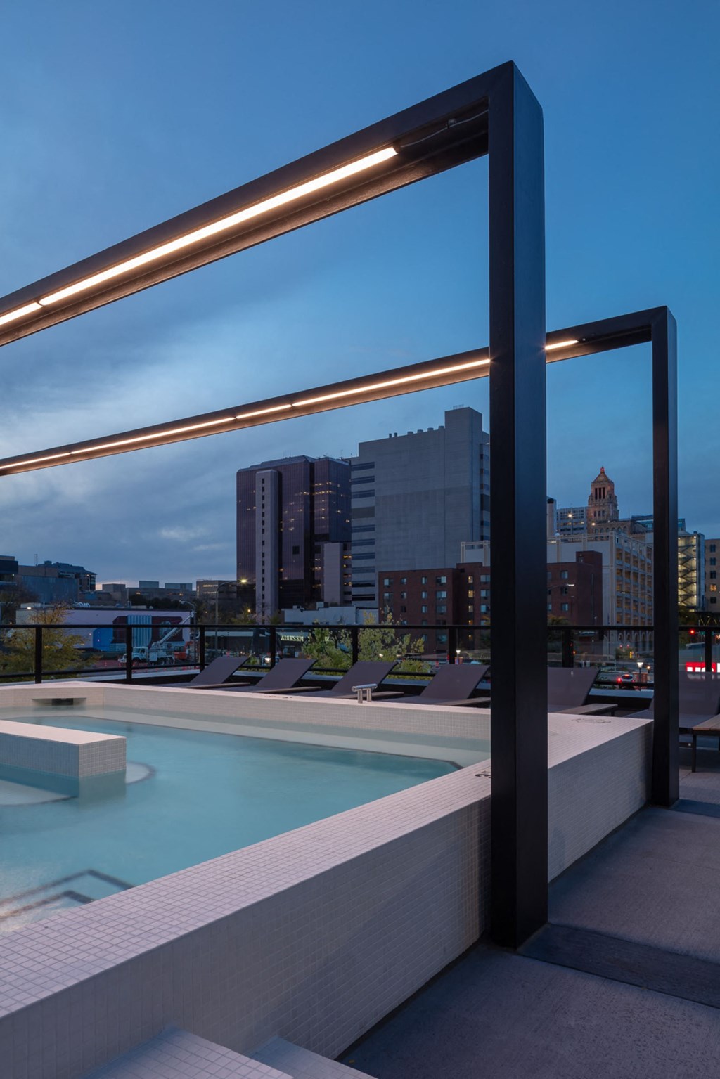 a view of the city from the rooftop of a building with a pool at Maven on Broadway, Rochester, MN