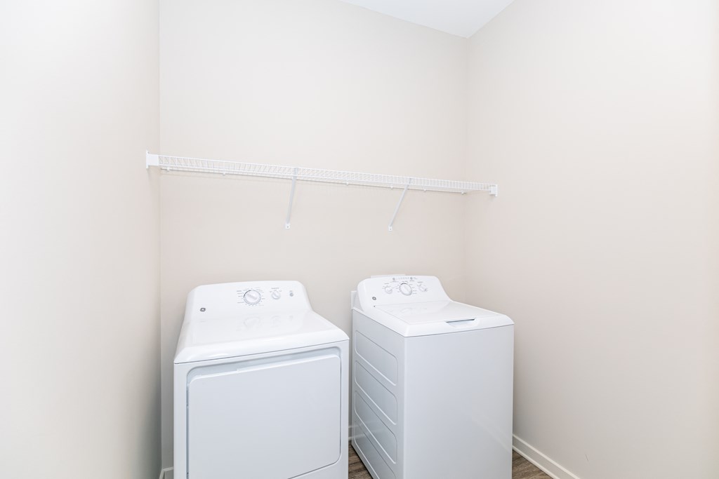 Washer and dryer in home  at The Station at River Crossing, Macon