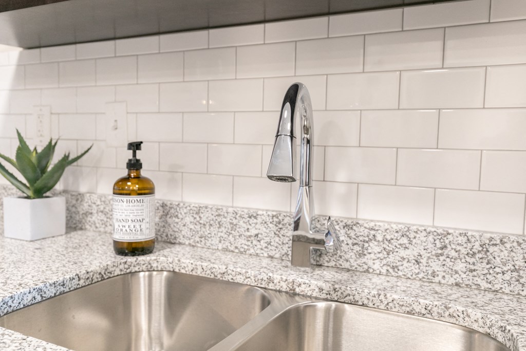 Tile backsplashes in kitchens  at The Station at River Crossing, Macon