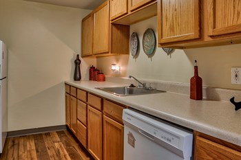 Kitchen appliances include range, refrigerator, dishwasher, and garbage disposal Kitchen appliances include range, refrigerator, dishwasher, and garbage disposal| The Boulders - Photo Gallery 3