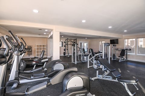 Fitness center with cardio and weight equipment at The Brittany, Indialantic, 32903