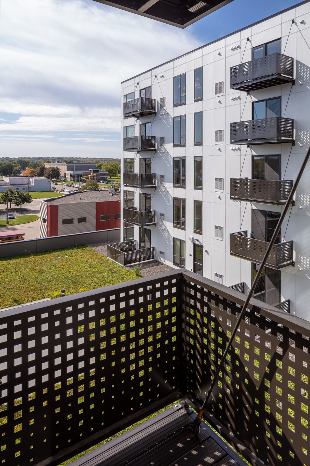 a view of an apartment building from a balcony at Maven on Broadway, Minnesota, 55904
