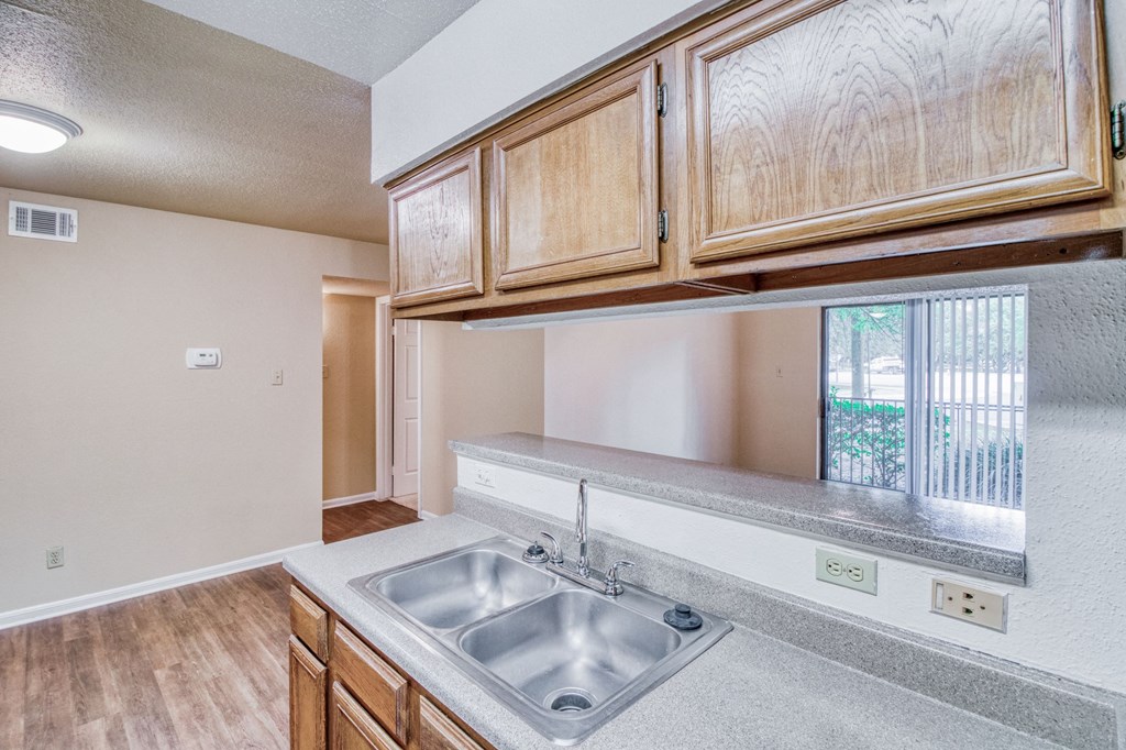 Kitchen with sink at Village Oaks Apartments, Austin