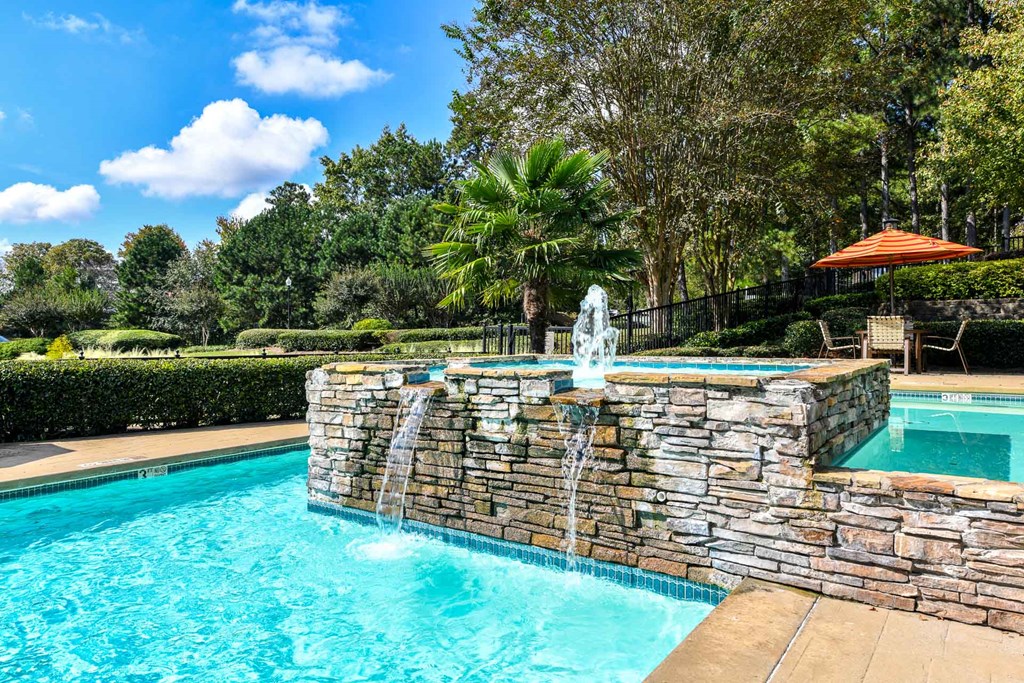 a swimming pool with a fountain at 670 Thornton, Lithia Springs