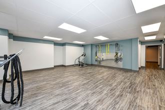 a fitness room with  weights