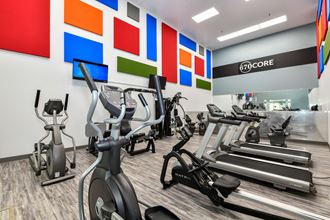 a room filled with lots of cardio exercise equipment