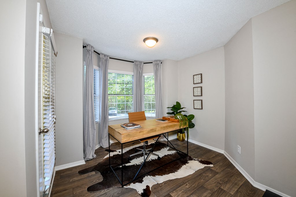 a room with a large window and a desk with a chair at 670 Thornton, Lithia Springs, Georgia