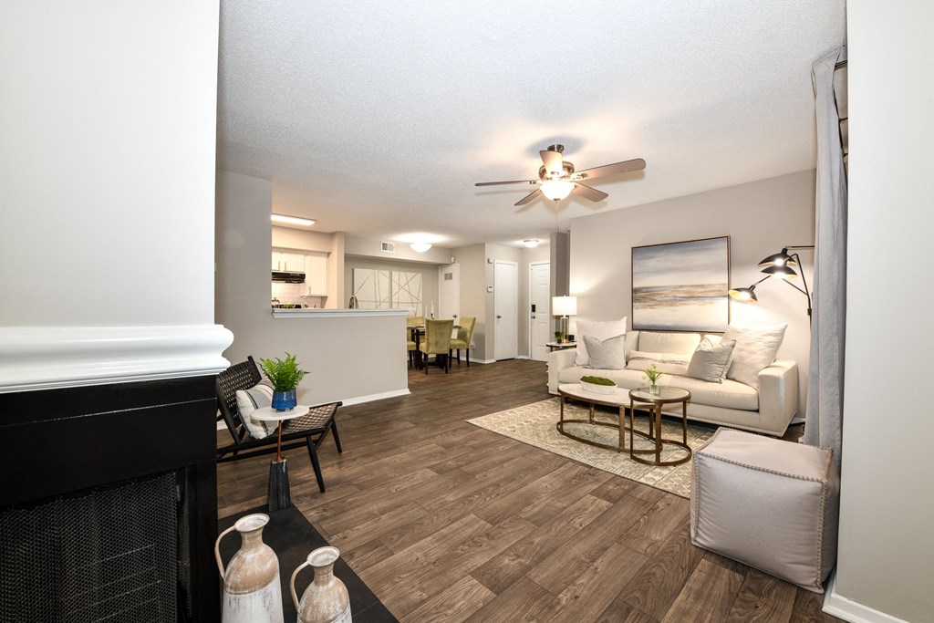 a living room with a fireplace and a ceiling fan at 670 Thornton, Georgia
