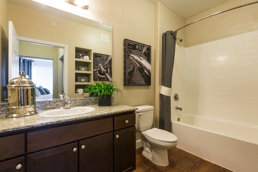 a bathroom with a sink and a toilet and a shower at Estate at Woodmen Ridge, Colorado Springs