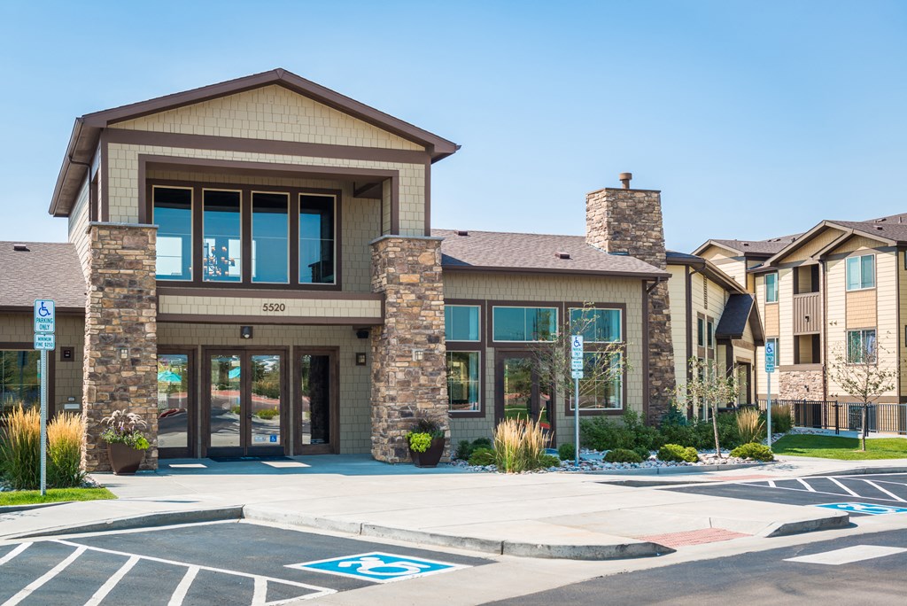 a building with a parking lot in front of it at Estate at Woodmen Ridge, Colorado Springs