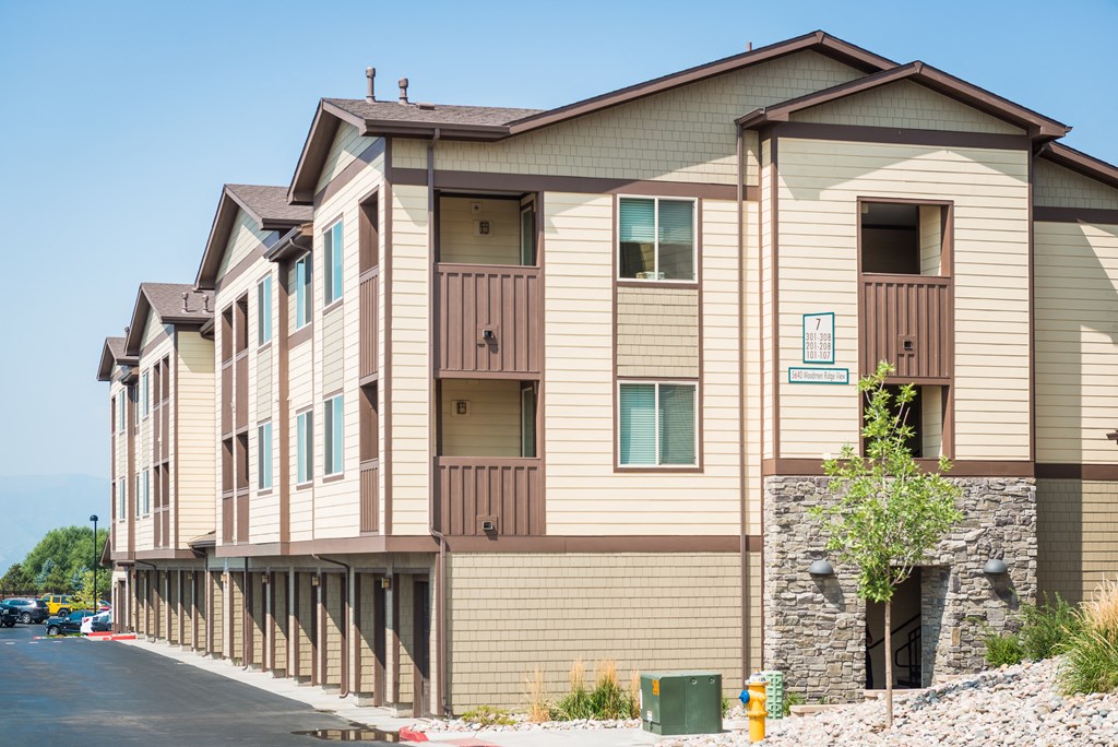 the exterior of a building with a street in front of it at Estate at Woodmen Ridge, Colorado Springs Colorado