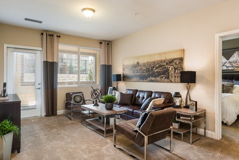 a living room with a couch and chairs and a table at Estate at Woodmen Ridge, Colorado
