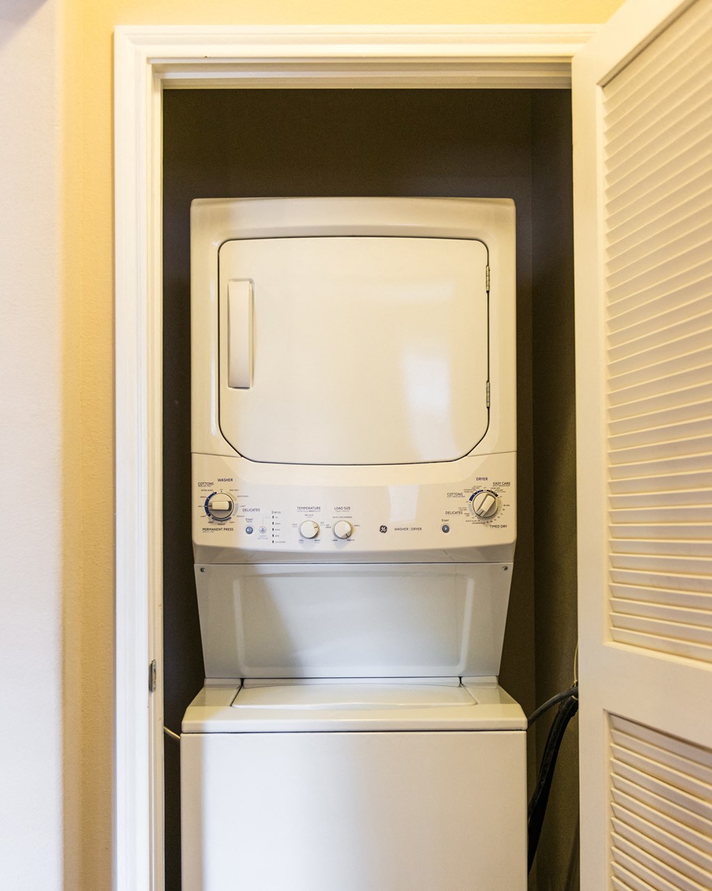 a white washer and dryer in a closet at Estate at Woodmen Ridge, Colorado Springs, CO 80923