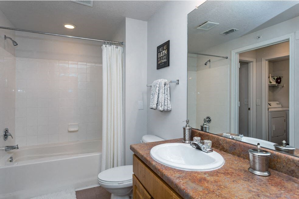Bathroom with tile surround at Cypress Legends, Fort Myers, FL, 33905
