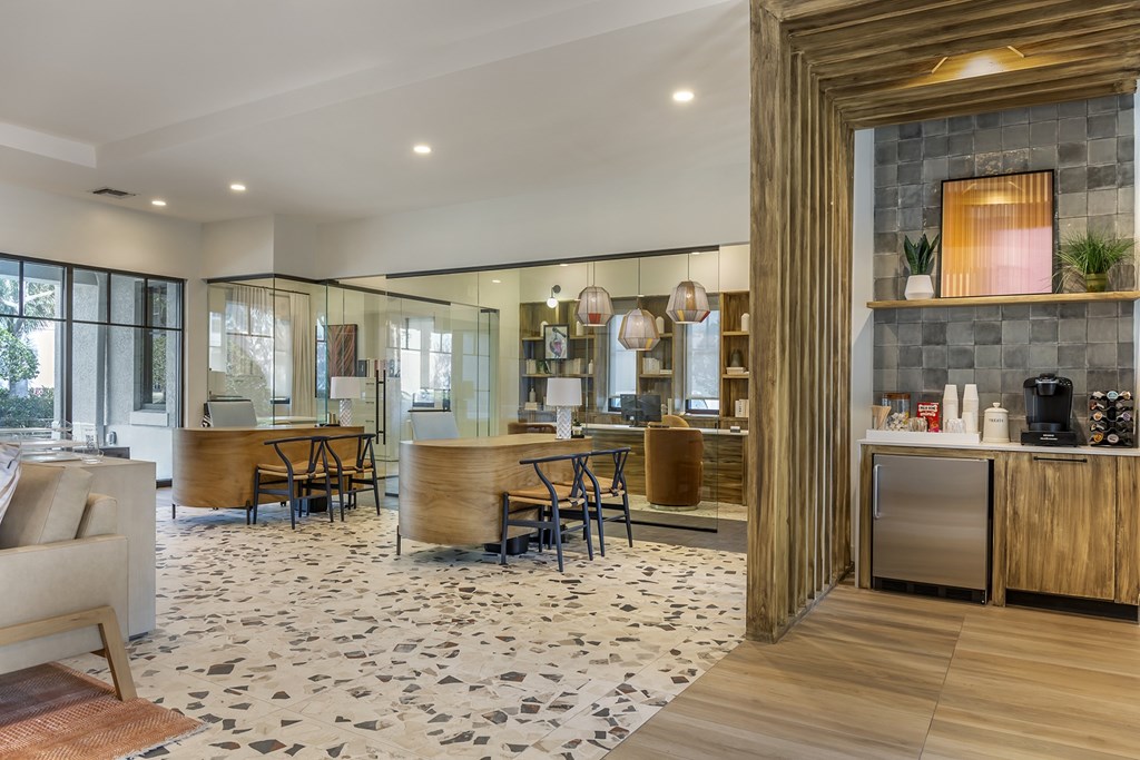 A modern kitchen with a black and white floor.