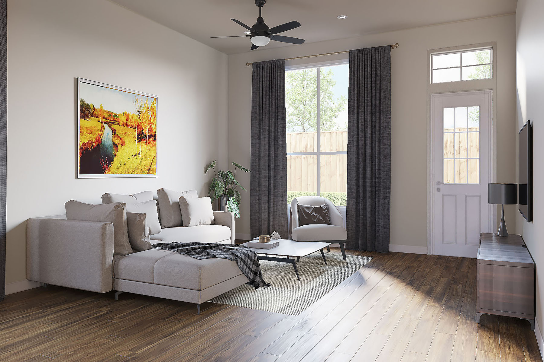 A living room with a large couch, a painting on the wall, and a ceiling fan.